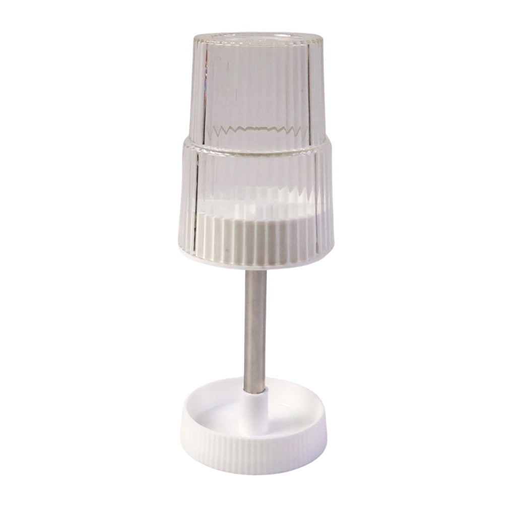 Storage slots of rotating toothbrush holder stand holding toothbrush and toothpaste