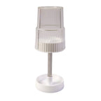Storage slots of rotating toothbrush holder stand holding toothbrush and toothpaste