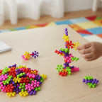 Hands assembling colourful building blocks toy set for creative learning