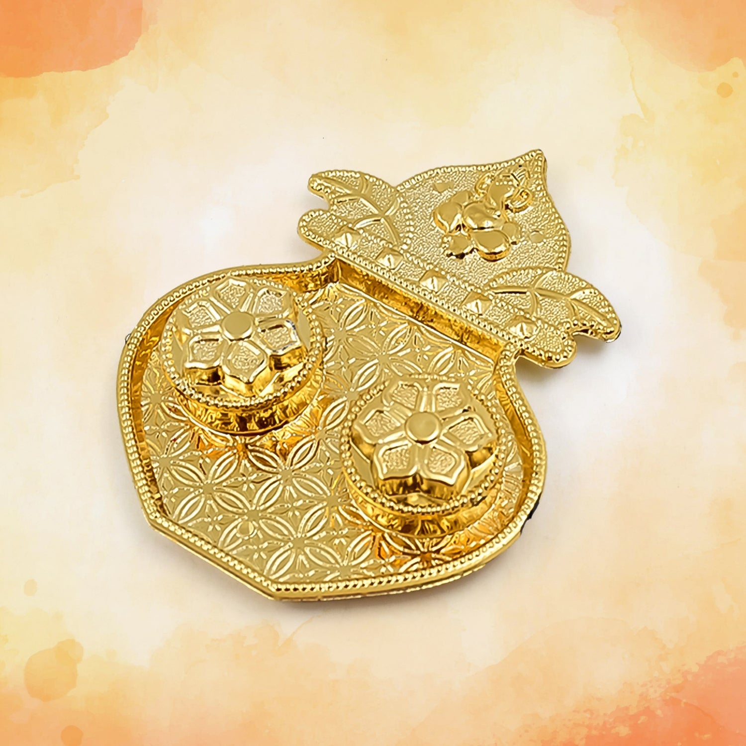 Detail of the integrated kumkum holders on the Raksha Bandhan thali.