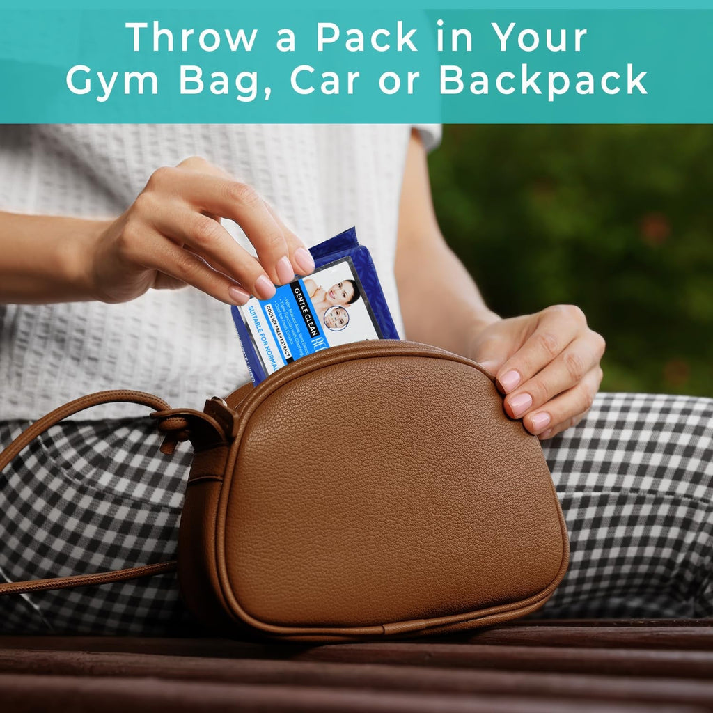 Hand pulling a hydrating wet wipe from the pack, showing its refreshing moisture.