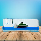 Floating Cruiser Ship Decor displayed on a car dashboard.