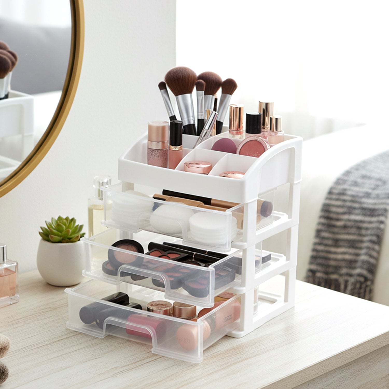 3 layer desktop storage organizer with transparent sliding drawers on a desk