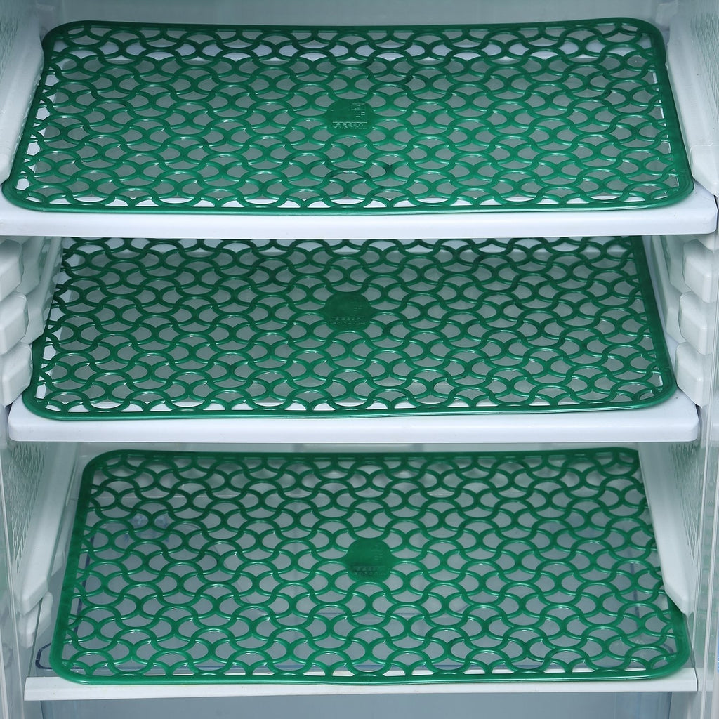 Fridge drawer mats preventing spills and scratches.
