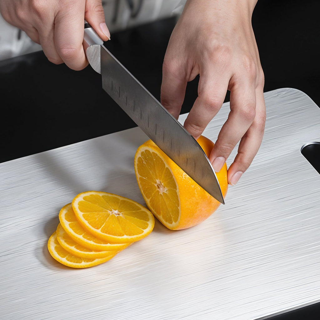 Pro stainless steel cutting board measuring 229mm by 330mm with anti-bacterial surface