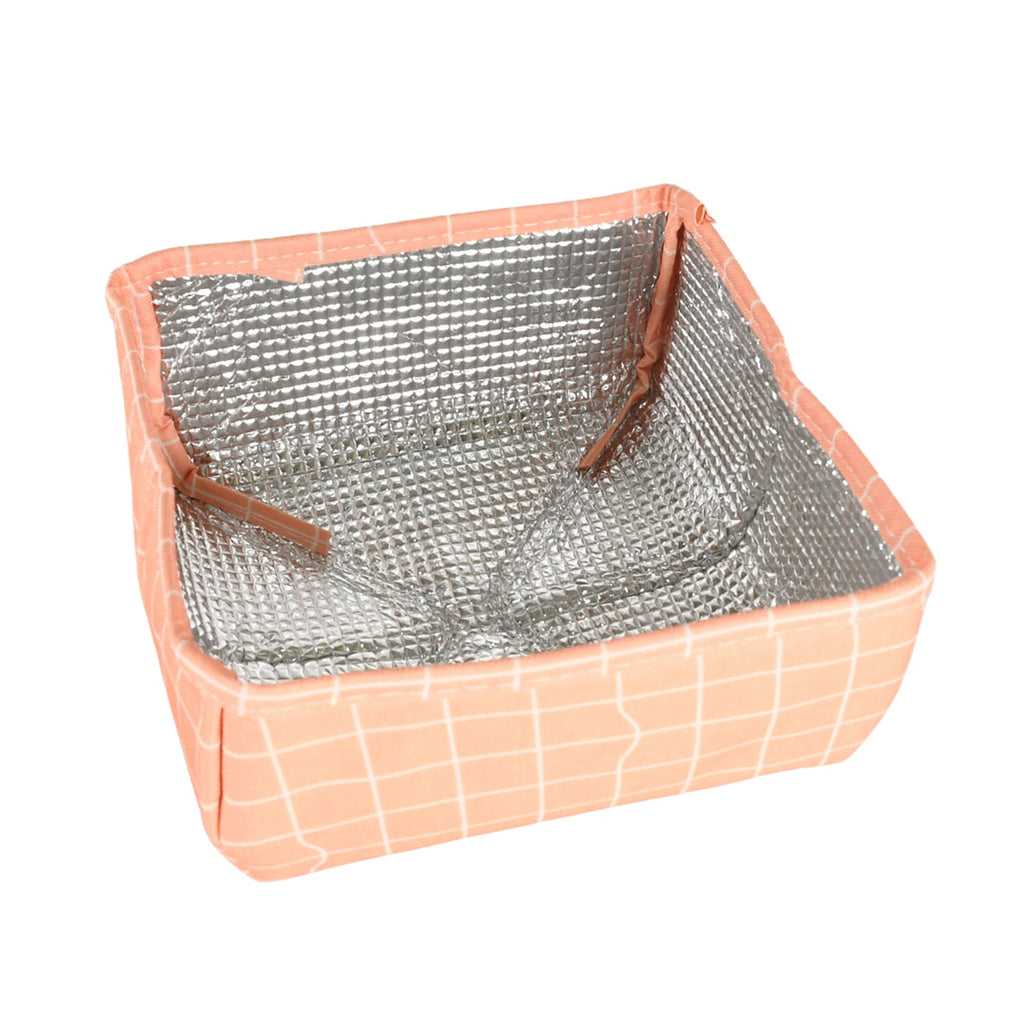 Foldable Food Cover keeping food safe and warm on a picnic table outdoors.