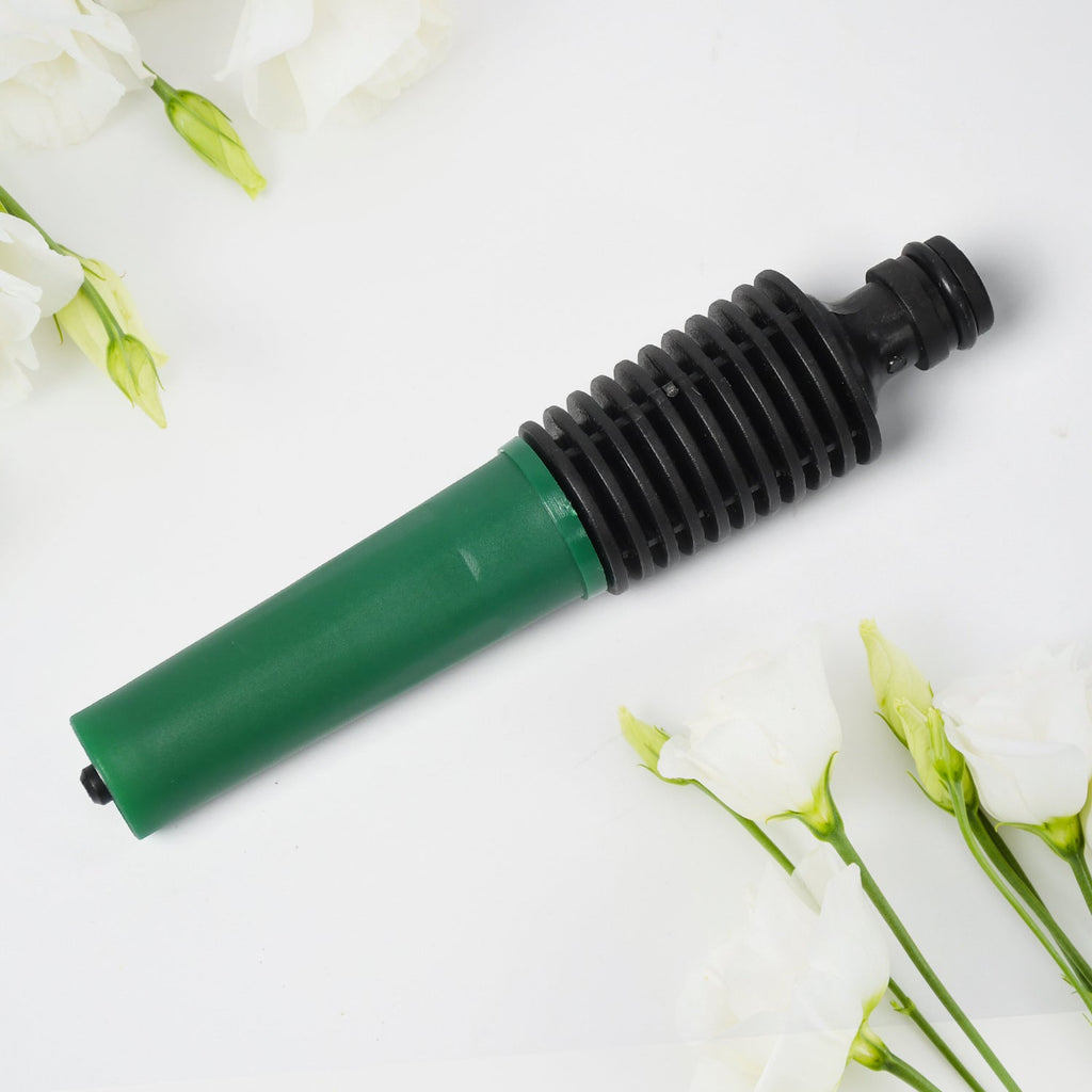Close-up view of a quick-fit hose fitting adapter from the nozzle set.