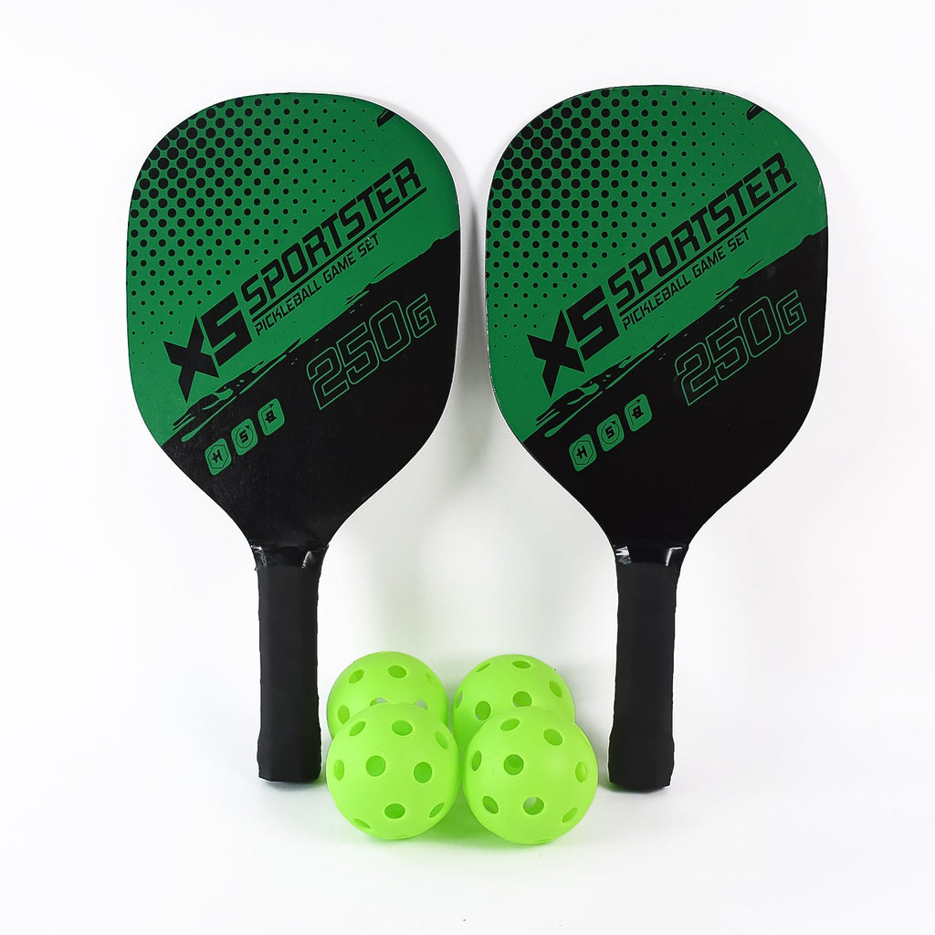 Four durable plastic perforated pickleball balls designed for controlled flight