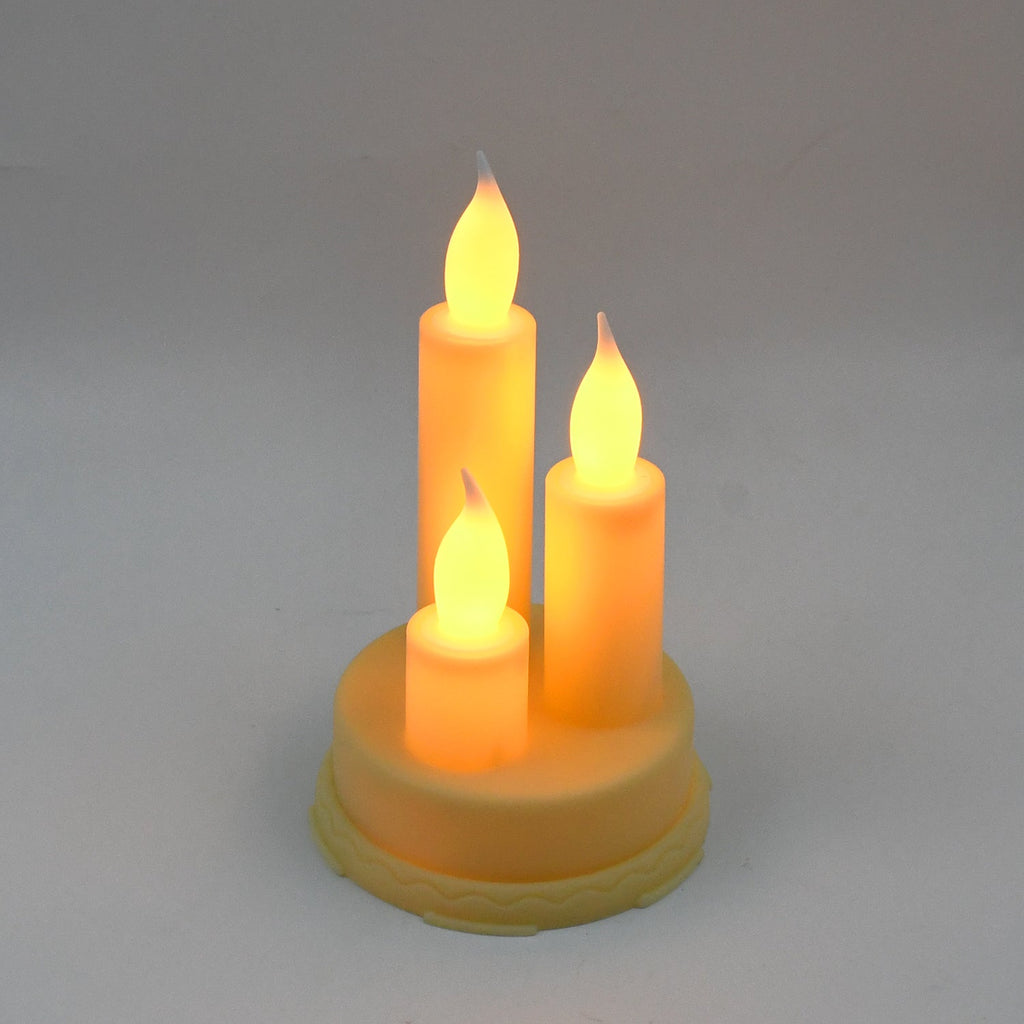Decorative LED taper candles arranged elegantly on a table, creating a festive ambiance.