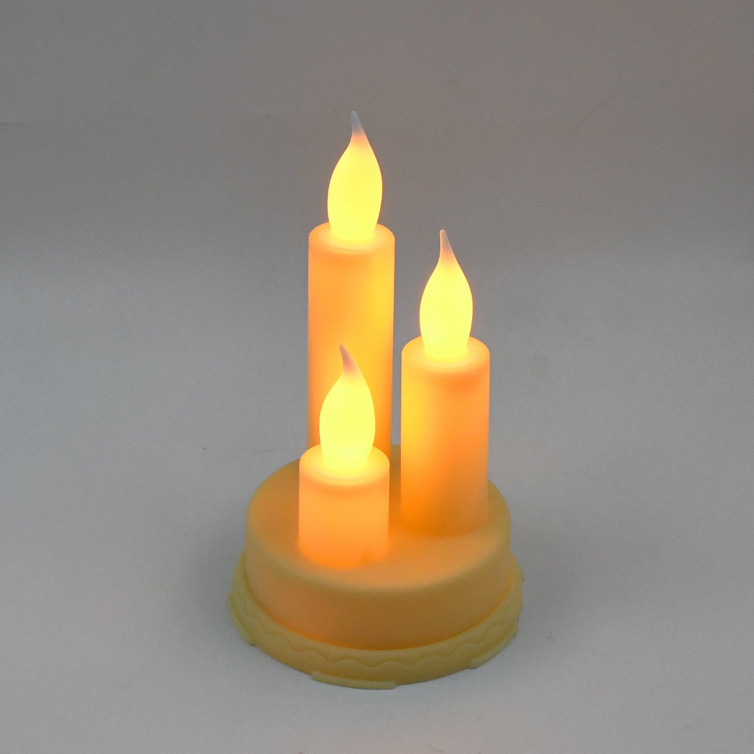 Decorative LED taper candles arranged elegantly on a table, creating a festive ambiance.