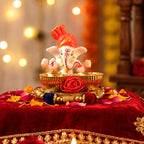 Traditional Ganesha idol with festive decorative pooja plate