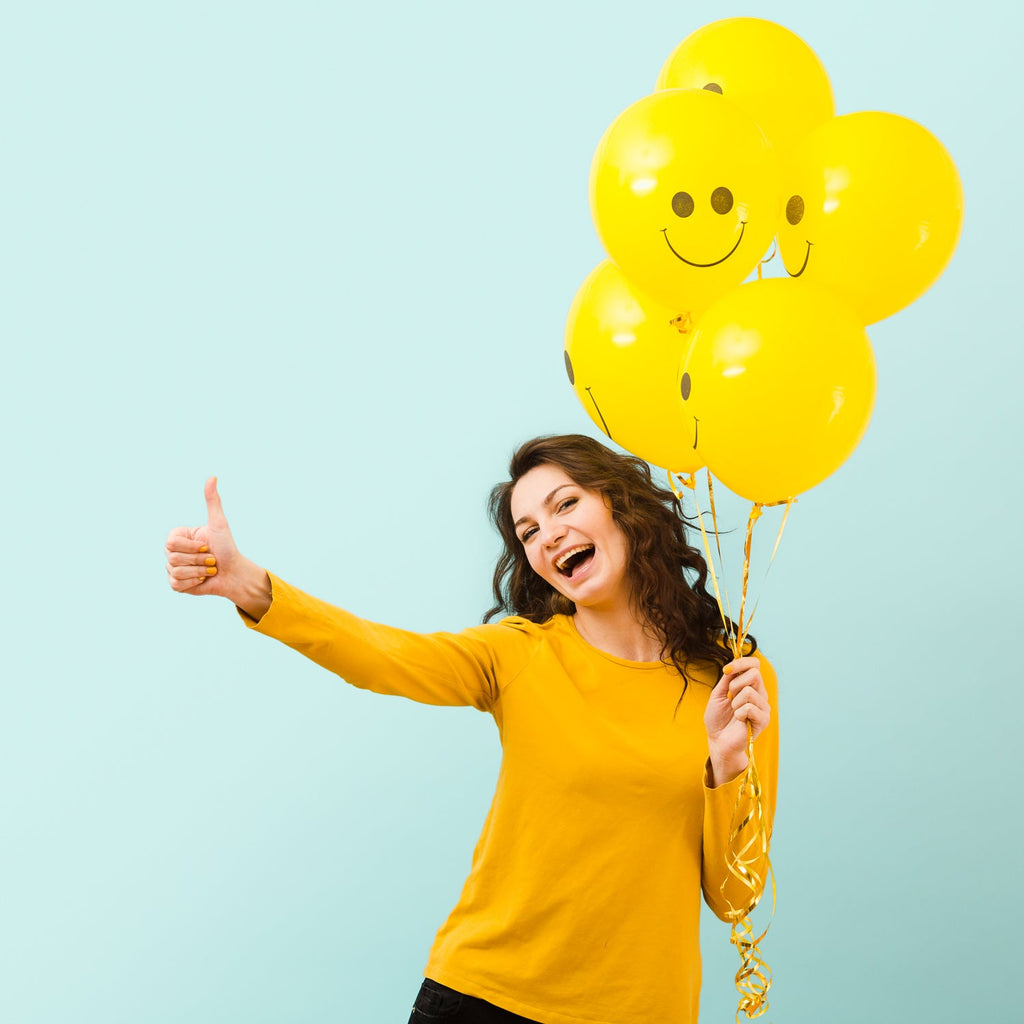 Group of decorative printed balloons in various bright colours.