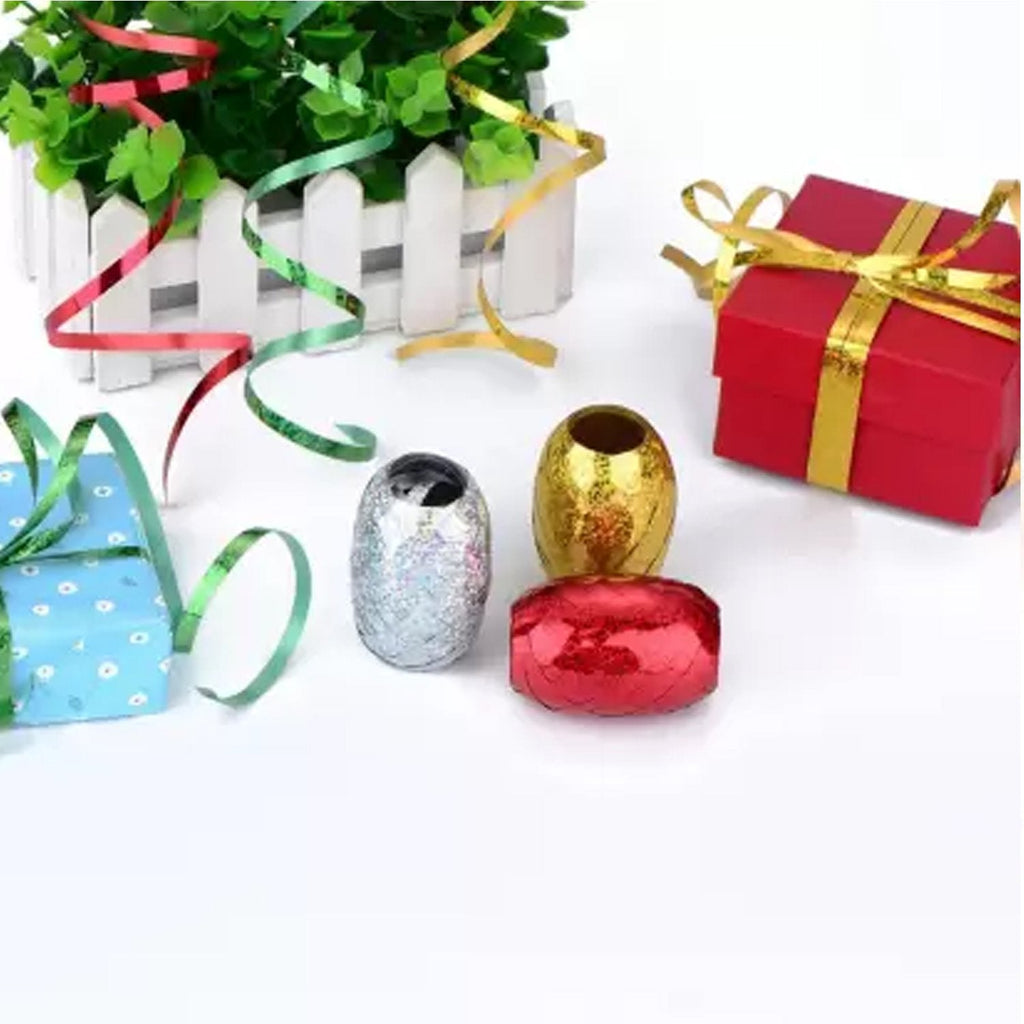 Bright curling ribbons in various colors, perfect for birthday party decor.