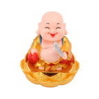 A vibrant Solar Buddha Car Ornament, bringing positive energy to any vehicle interior.