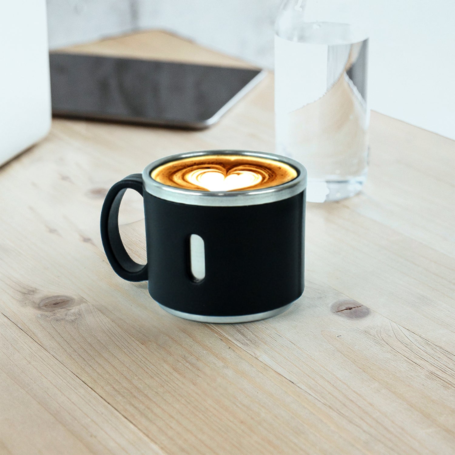 Six Apex stainless steel desk mugs stacked neatly on counter