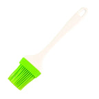 Silicone kitchen spatula brush used for applying oil and ghee on baking items