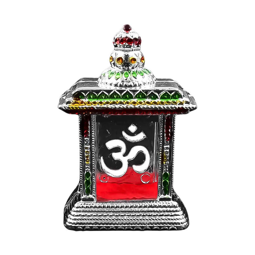 Small Om Temple elegantly placed in a home mandir setting.