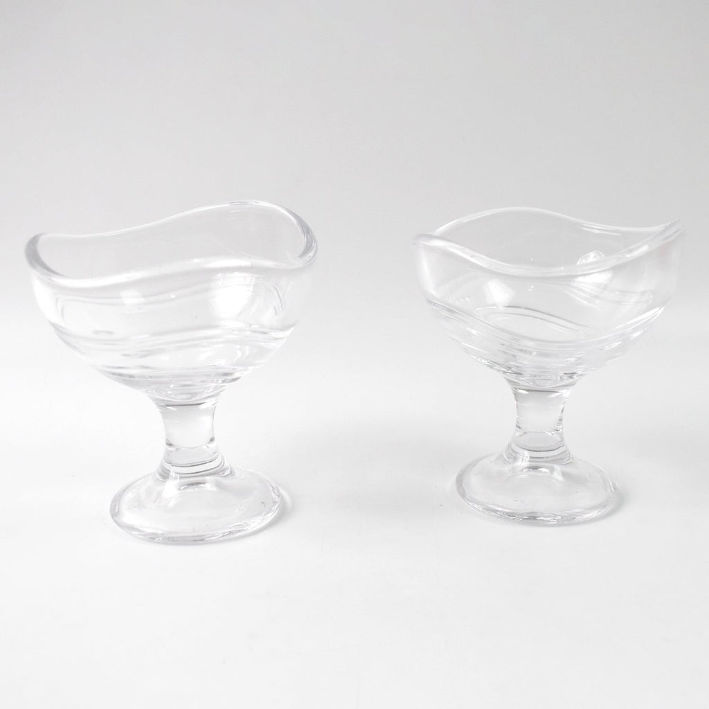 Clear glass dessert bowl highlighting its sturdy footed base.