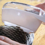 Close-up of the Fish Scale Scraper collecting case preventing mess.