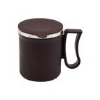 A stylish insulated tea mug in yellow, showcasing its comfortable handle and compact size.