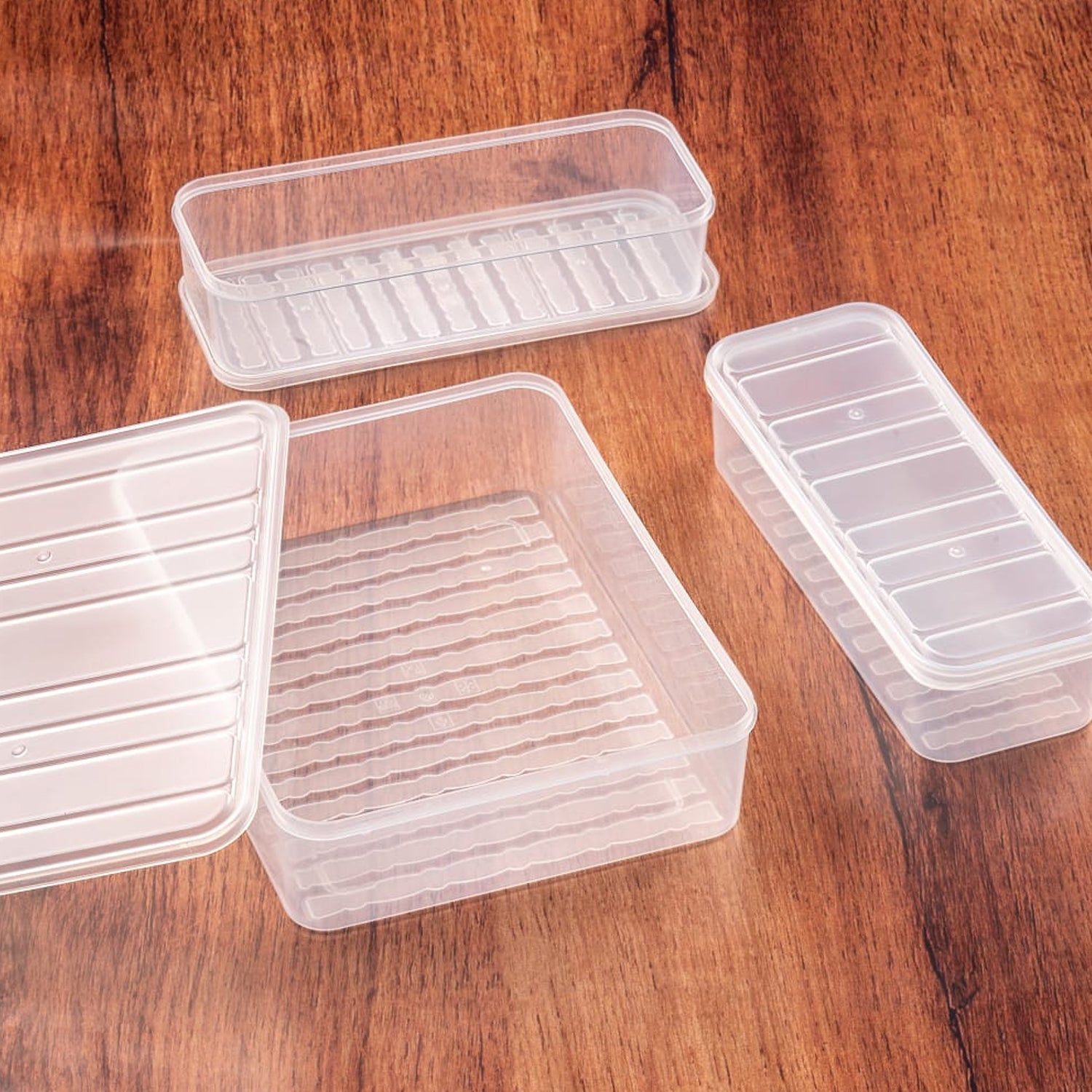 Side view of a single plastic food storage container with an airtight blue lid.
