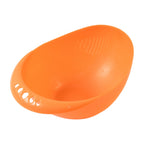 Close-up of the finely designed drainage holes in the plastic washing bowl.