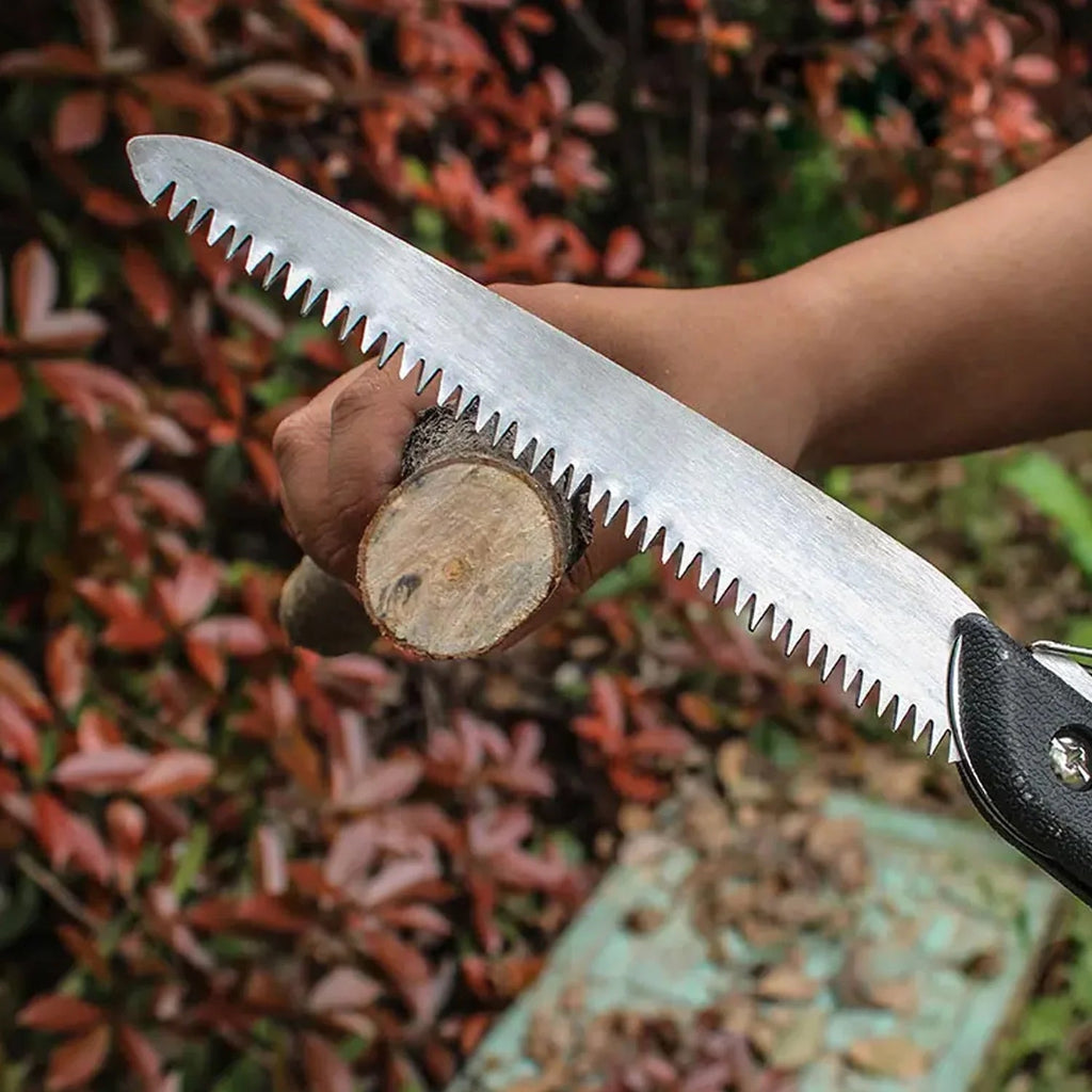Folding handsaw with SK5 steel blade, ready for precise tree trimming.