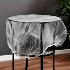 Heavy-duty plastic sofa cover protecting a large couch from dust and spills.