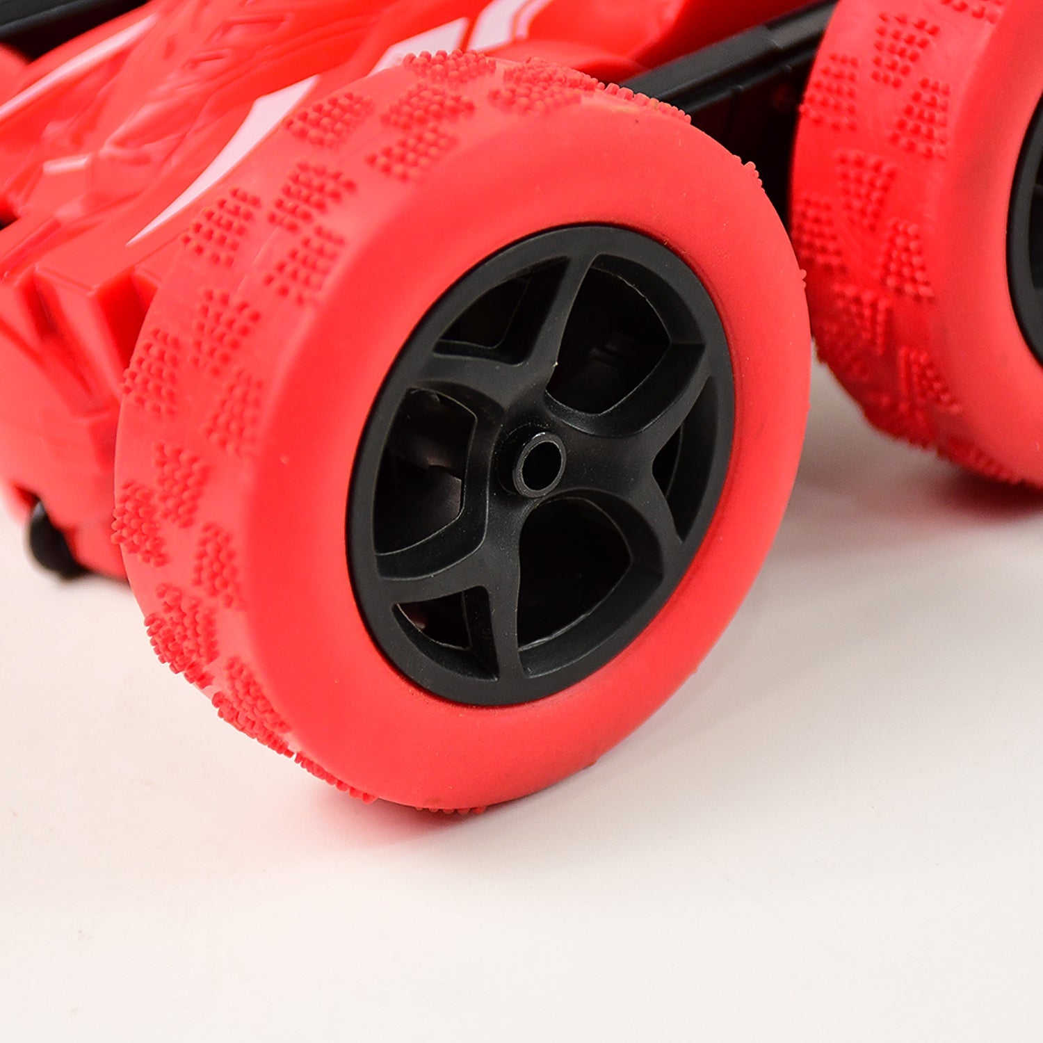 Electroplay remote control stunt car side view highlighting tire details