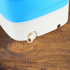 Portable washing machine with a clear view of its interior capacity for small loads.