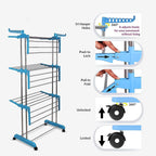 A close-up of clothes drying on the multi-tier laundry rack, highlighting its capacity.