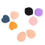 Hand holding Mini Finger Makeup Powder Puff applying makeup smoothly