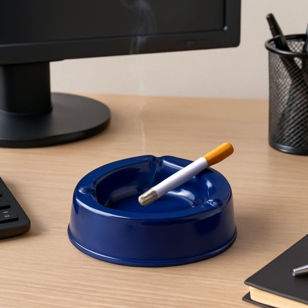 Dark blue plastic ashtray with wide bowl and 3 cigarette slots
