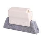 Flexible bristles of the crevice cleaning brush reaching tight spaces.