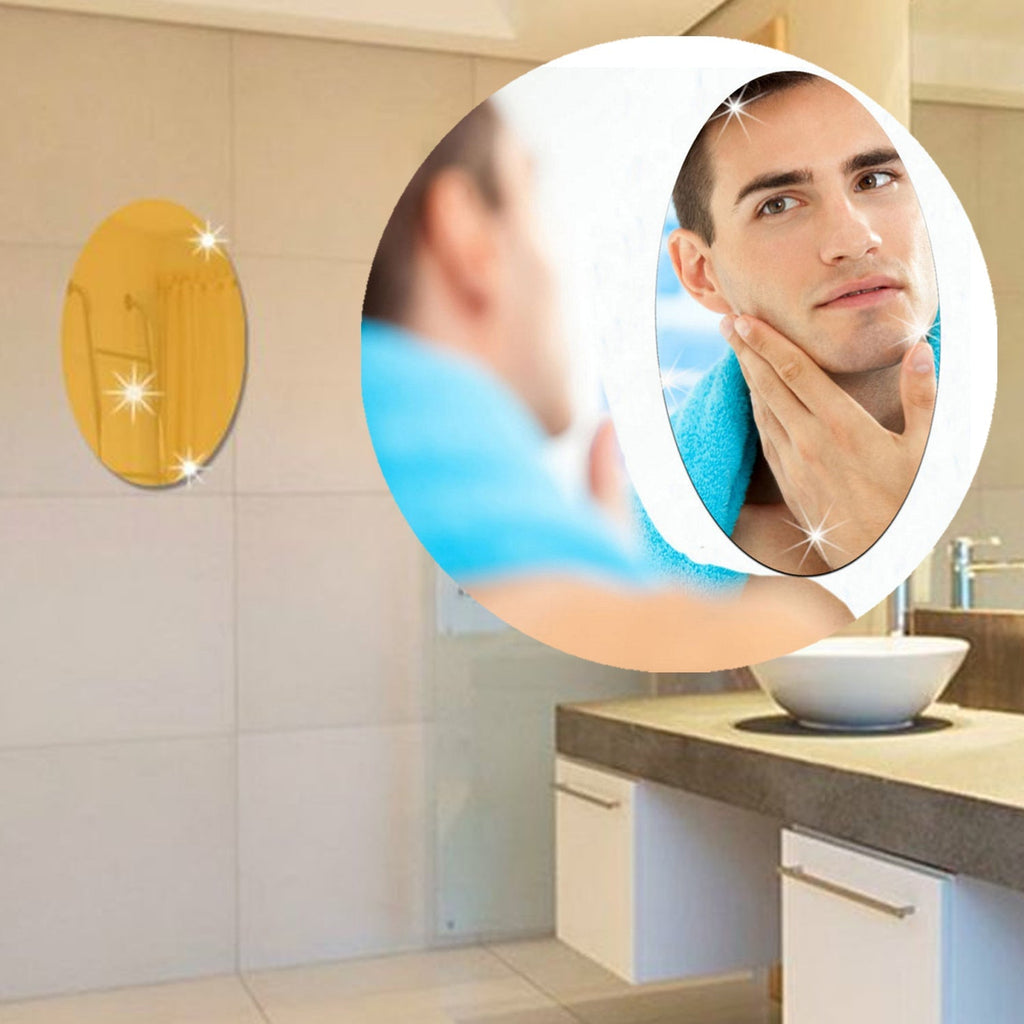 Multiple Styleva oval mirror stickers creating an artistic wall display.