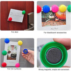 Yellow circular magnets holding multiple papers on office board