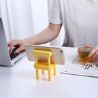 Close-up of the smooth, premium beech wood texture of the Mini Chair Phone Stand.