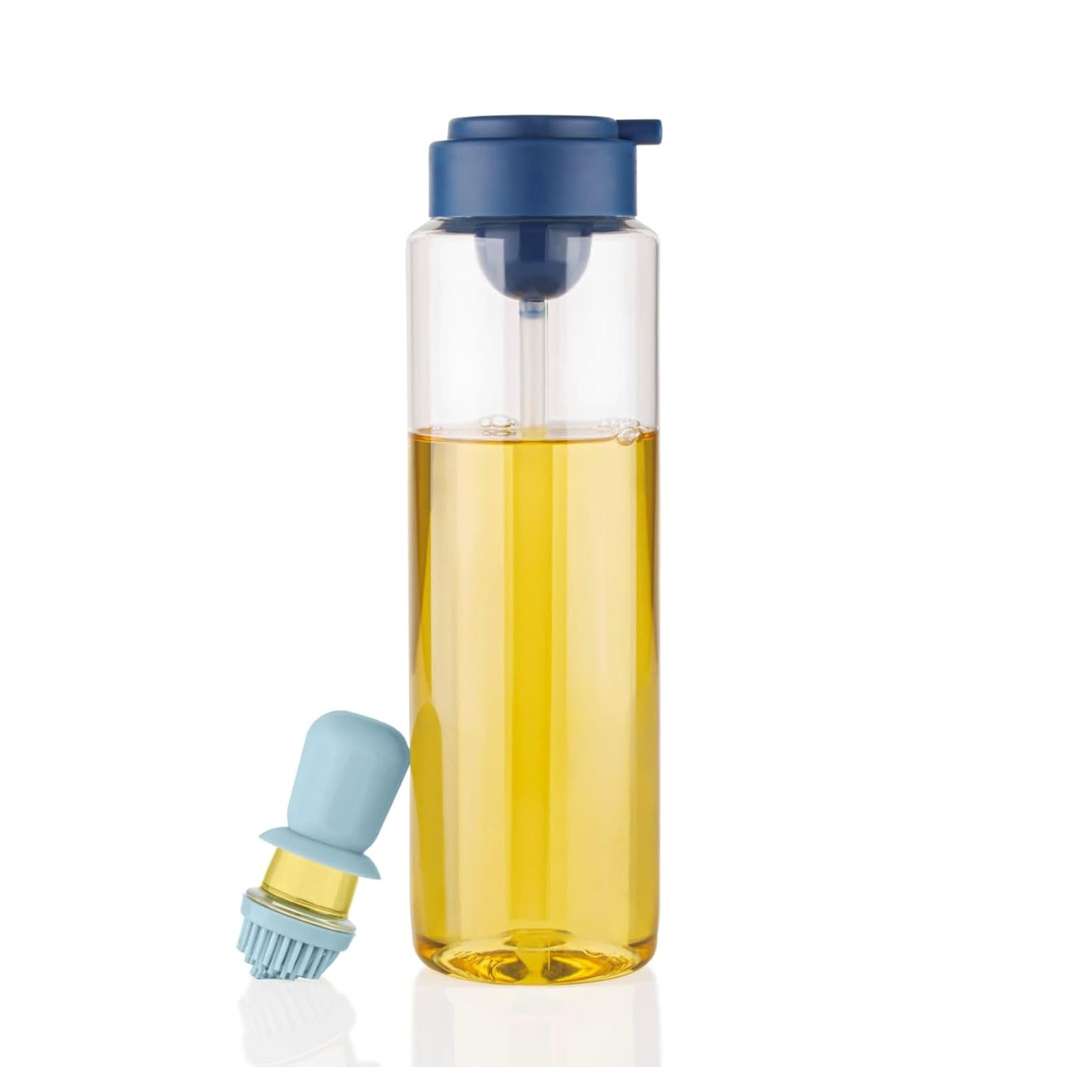 Transparent kitchen oil dispenser bottle, clearly showing the oil level inside, ready for use.