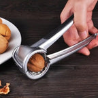 Die-cast alloy walnut cracker with a bottle opener function, perfect for kitchen use.