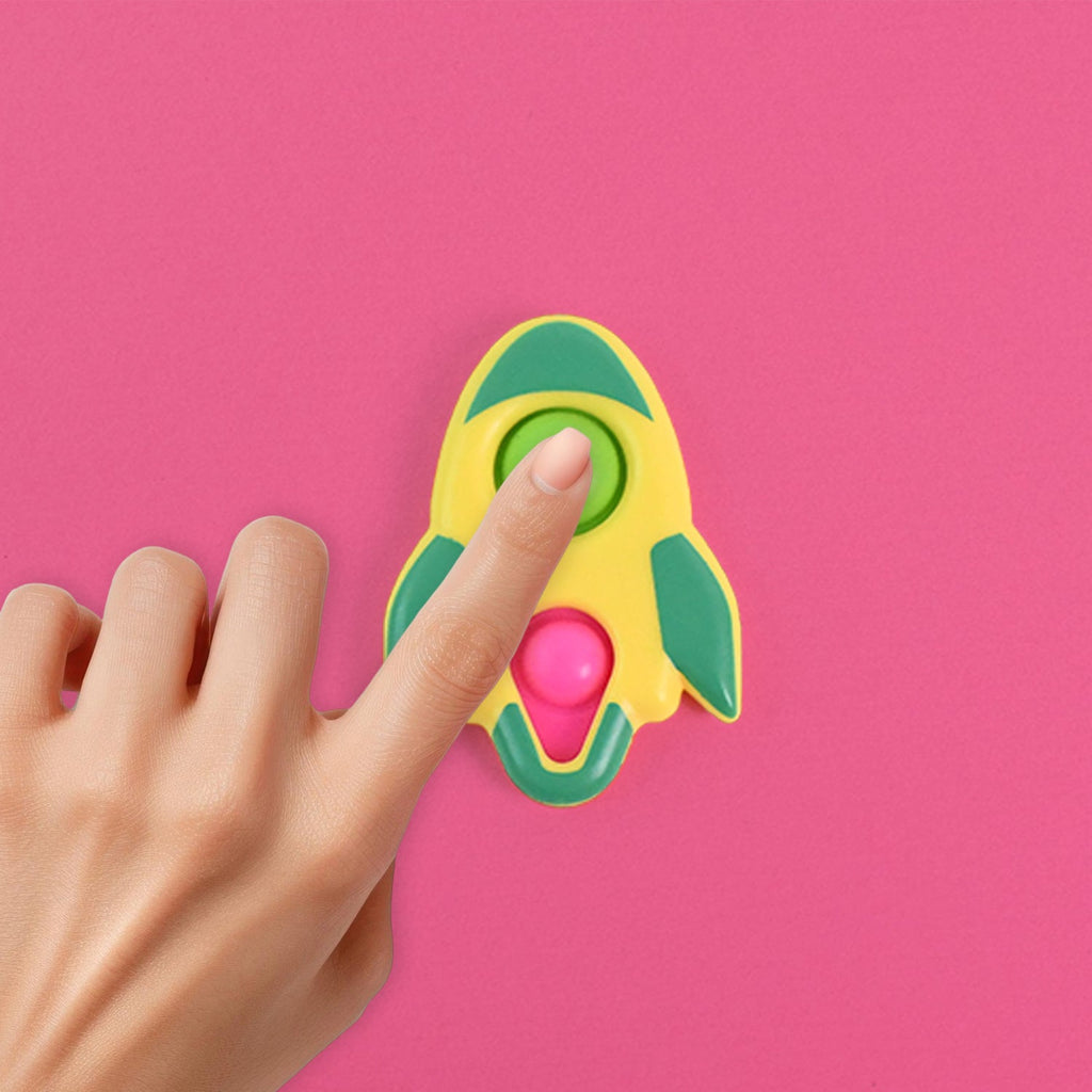 Child's hands playing with the rocket-shaped fidget keychain toy