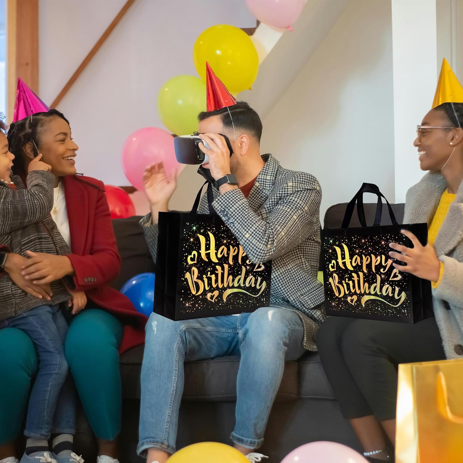 Texture detail of black birthday gift bag with shining golden stars