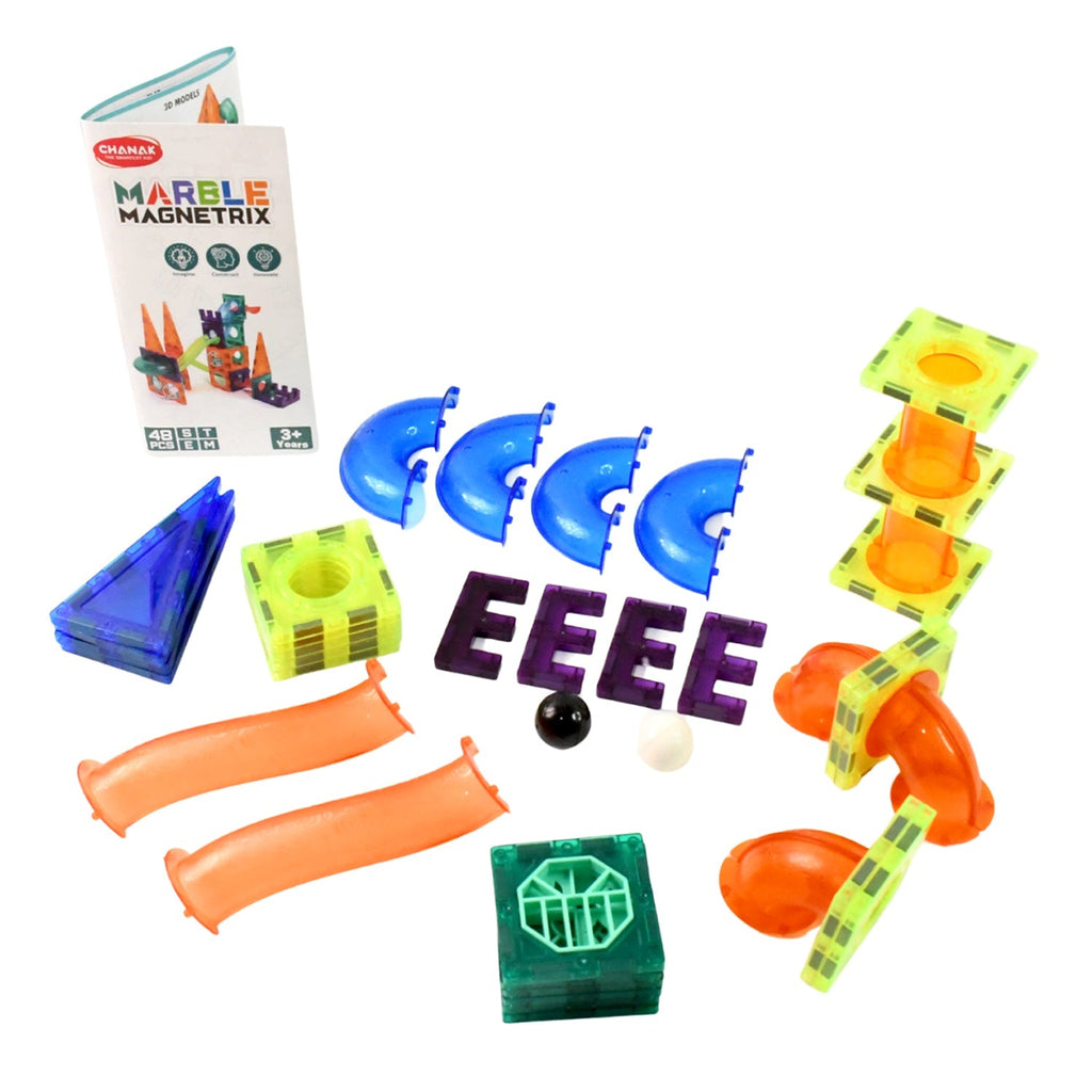 Child observing marbles rolling through Magnetic Marble Run toy
