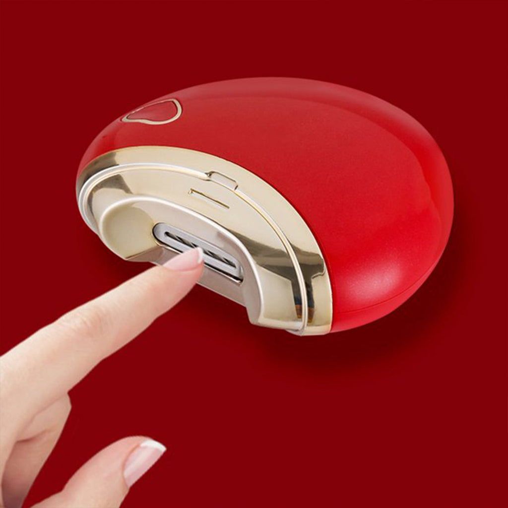 Electric nail clipper showing USB charging port and cleaning brush included