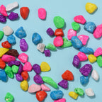 Assortment of vibrant decorative pebbles and stones for garden landscaping.