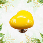 Elegant red heart-shaped cabinet pull, showcasing its smooth finish and unique design.