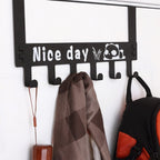 Over door hook rack organizing various clothing items and accessories neatly.