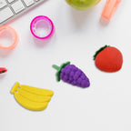 A playful pile of diverse 3D food erasers, ready for creative fun.