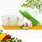 Top view of garlic chopper featuring ergonomic green hand-push lid