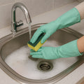Long cuff rubber cleaning gloves protecting hands during dishwashing