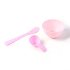 Close-up of facial mask mixing tools including spatula and spoon